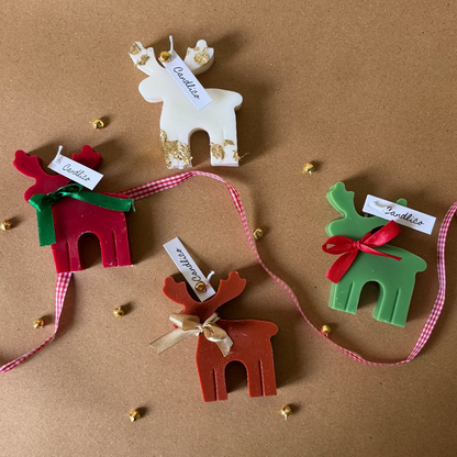 Set of Christmas-themed ceramic ornaments on a brown background